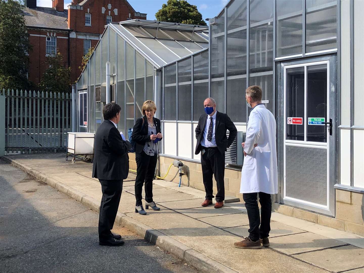Professors have a briefing outside climate change greenhouse. Picture: University of Greenwich