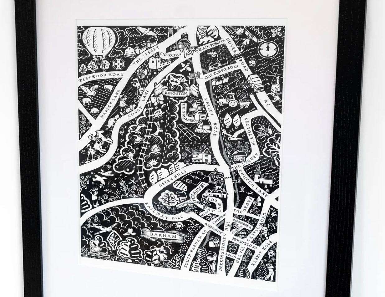 After he finishes the designs, Daniel's maps are printed as giclée and aluminium prints and made into tea towels