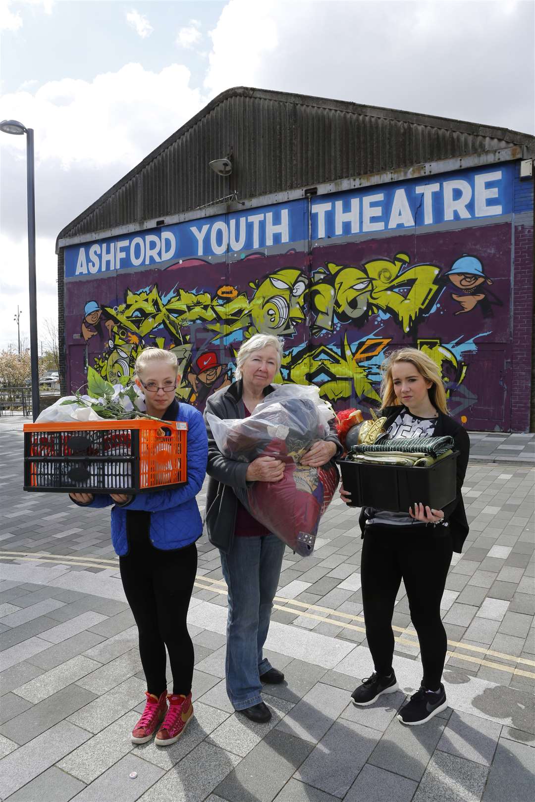 Jess Cross, Stella Critchley and Sinead Stockman packing up the props at Ashford Youth Theatre in Dover Place