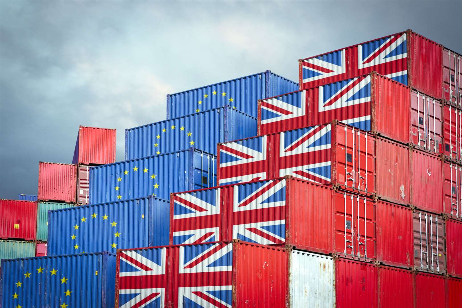 Cargo containers with European Union and British flags reflecting Brexit and restrictions in export and import (43757182)
