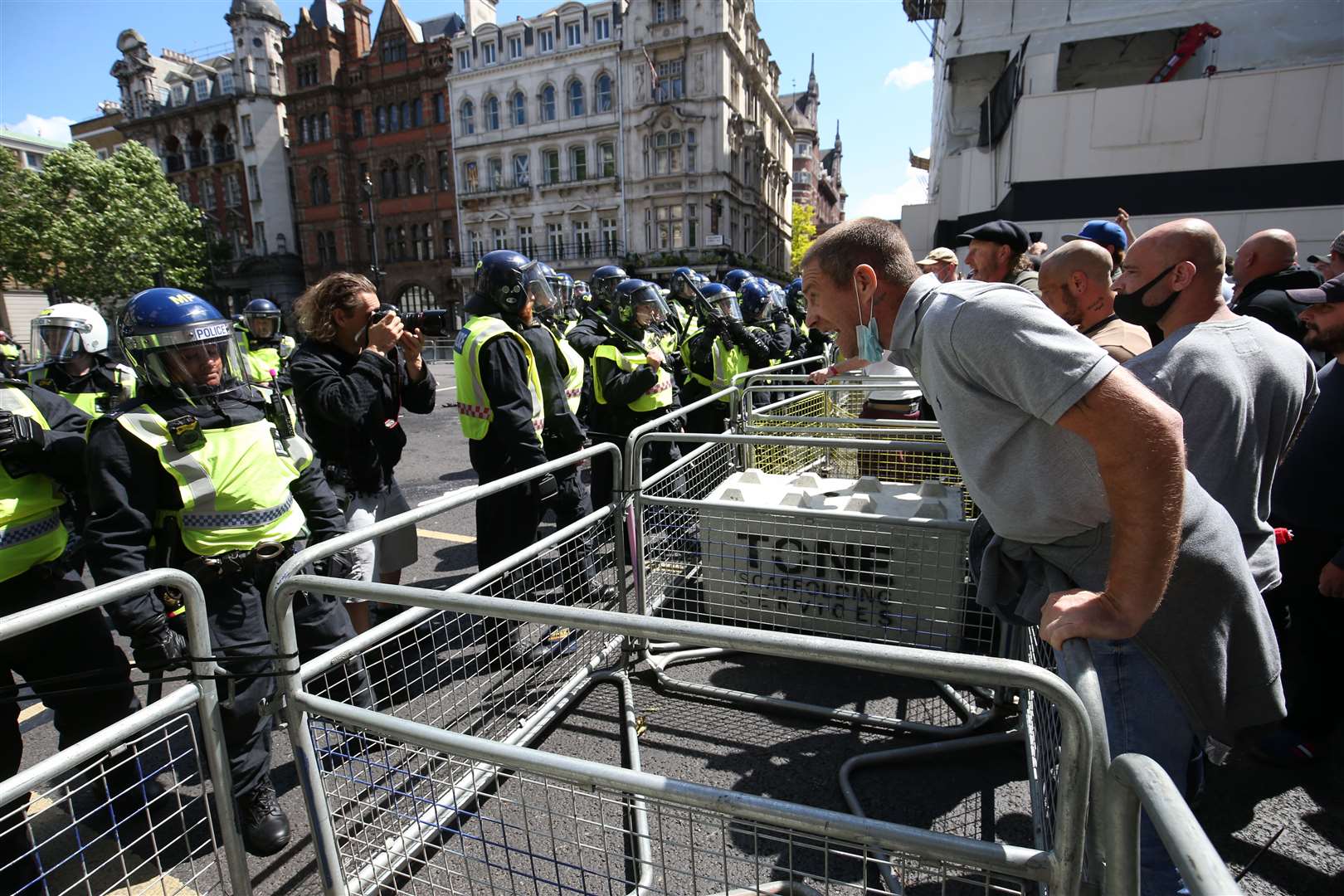 Police are confronted by protesters in Whitehall near Parliament Square, London (Jonathan Brady/PA)
