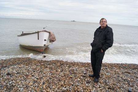 John Chapman with his boat Jonita, which was wrecked after taking on water in heavy winds