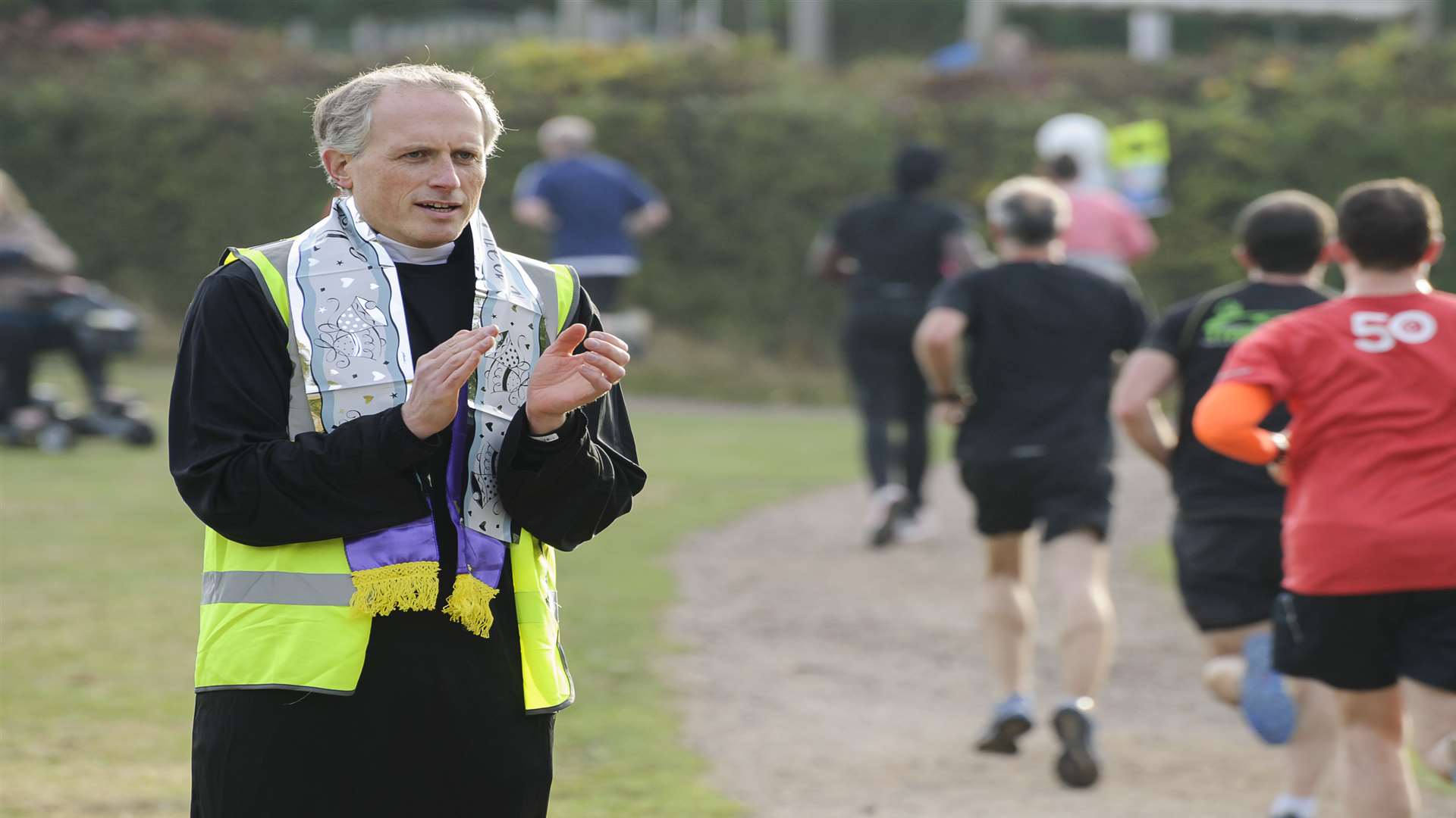'Vicar" Jonathan Crowle cheers the runners on. Picture: Andy Payton