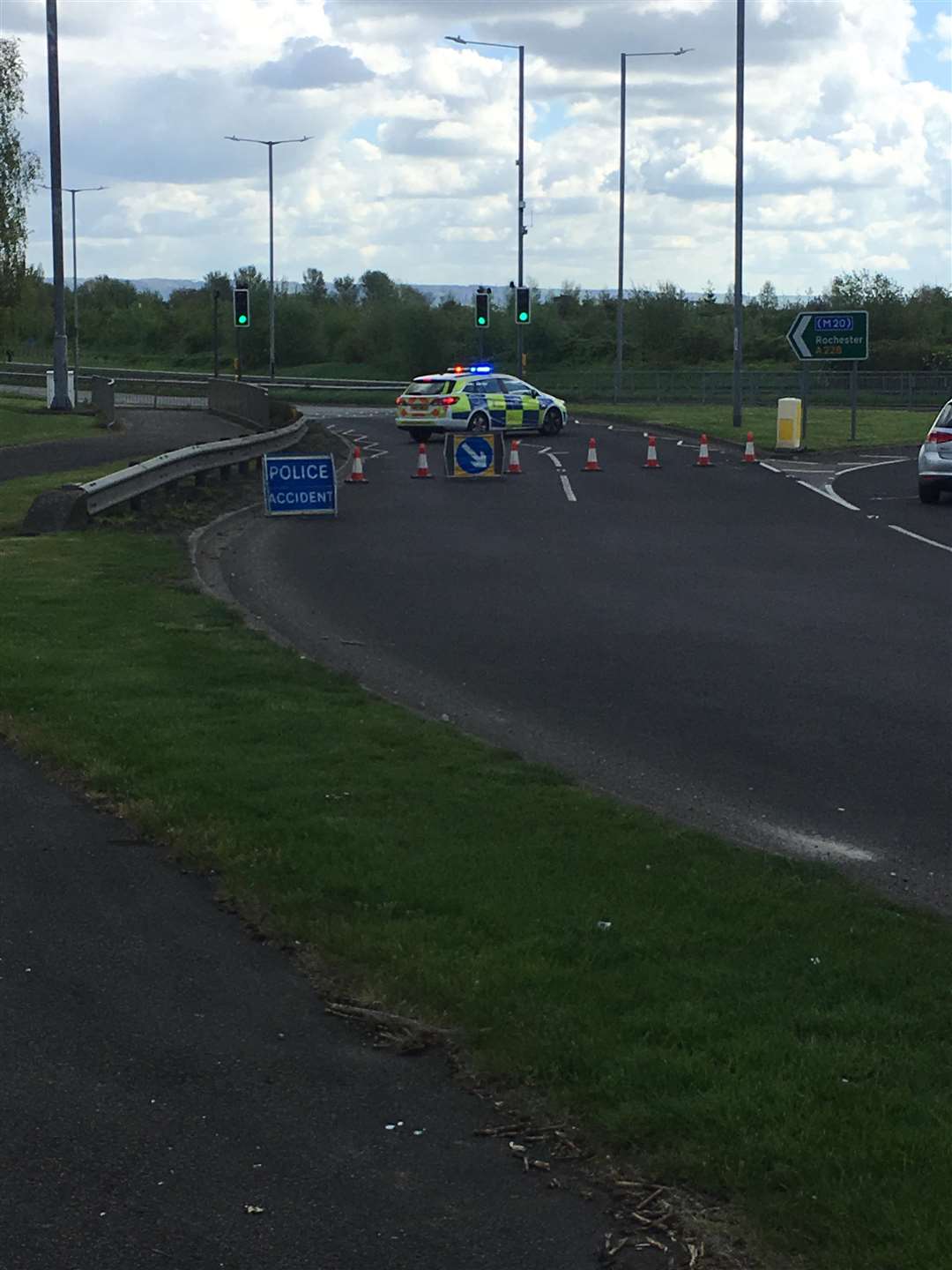 Police remain at the scene of a collision on the A228 this morning