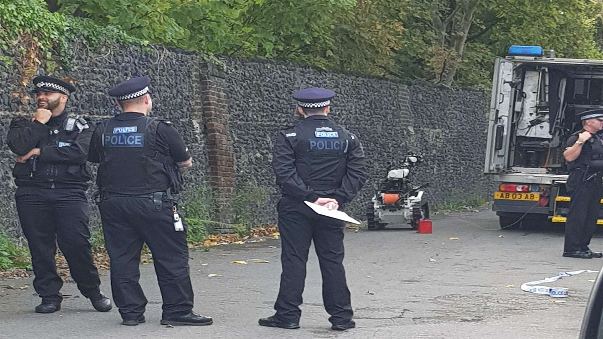 Police at the scene with a specialist robotic device. Photo by David Carnell