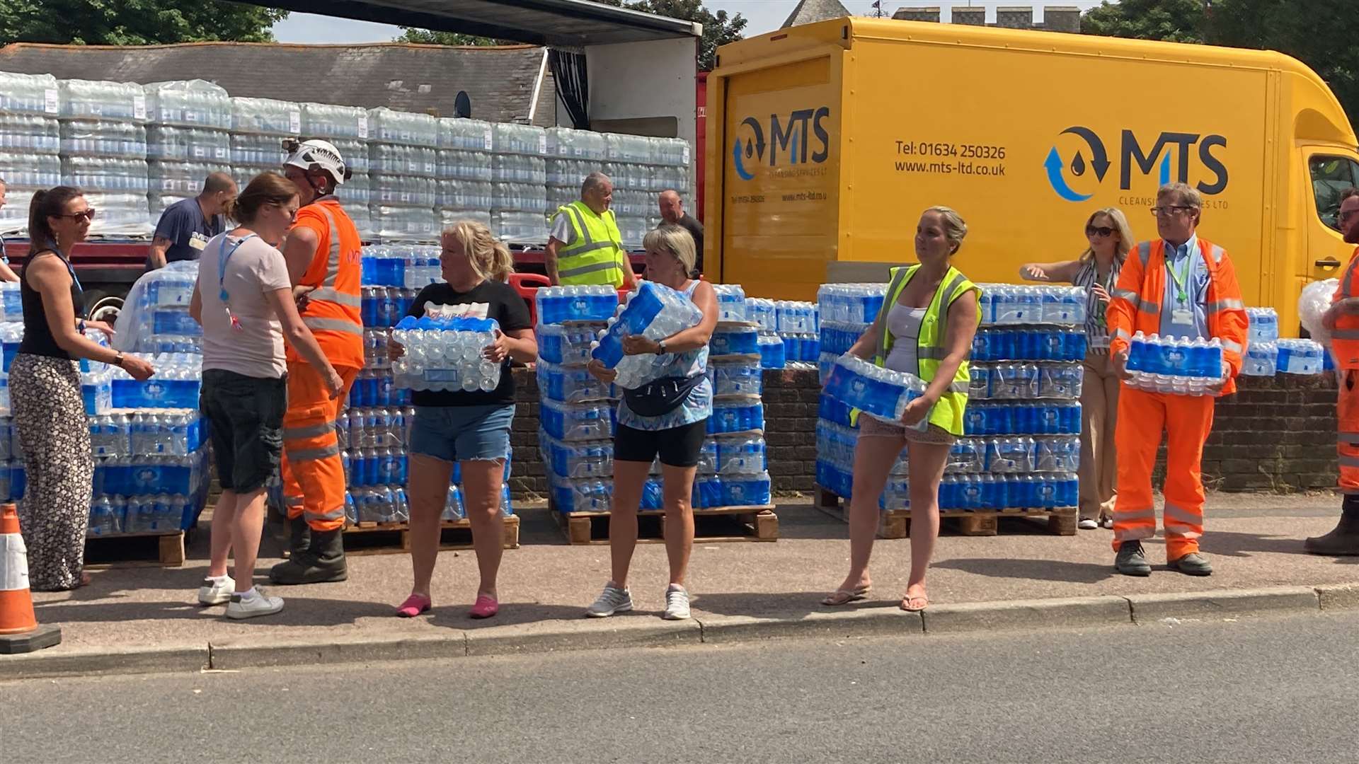 Volunteers at Minster WMC getting ready to hand out water bottles to motorists