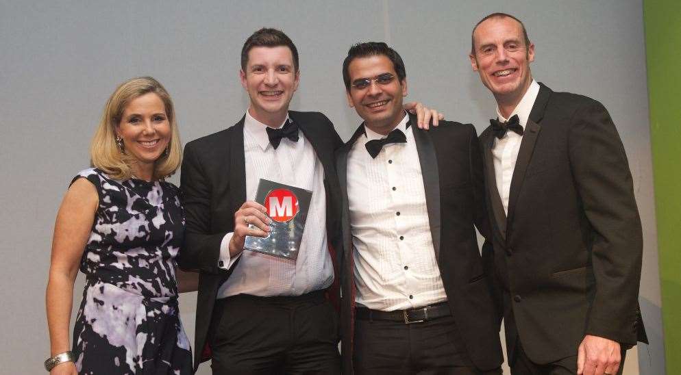 Will Davies and Ritesh Menghi of Kent Reliance accept the Best Bank Savings Provider award from host Sally Phillips and Lee Tillcock, editor of Moneyfacts.