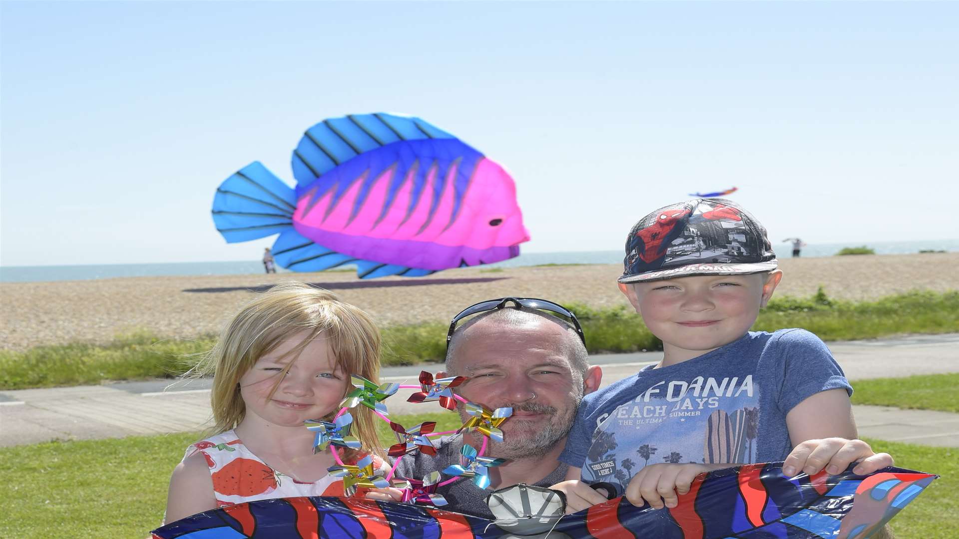 The Harrisons enjoy kite flying at Walmer Green. Pictured are Violet aged five, Alan and seven year old Oscar