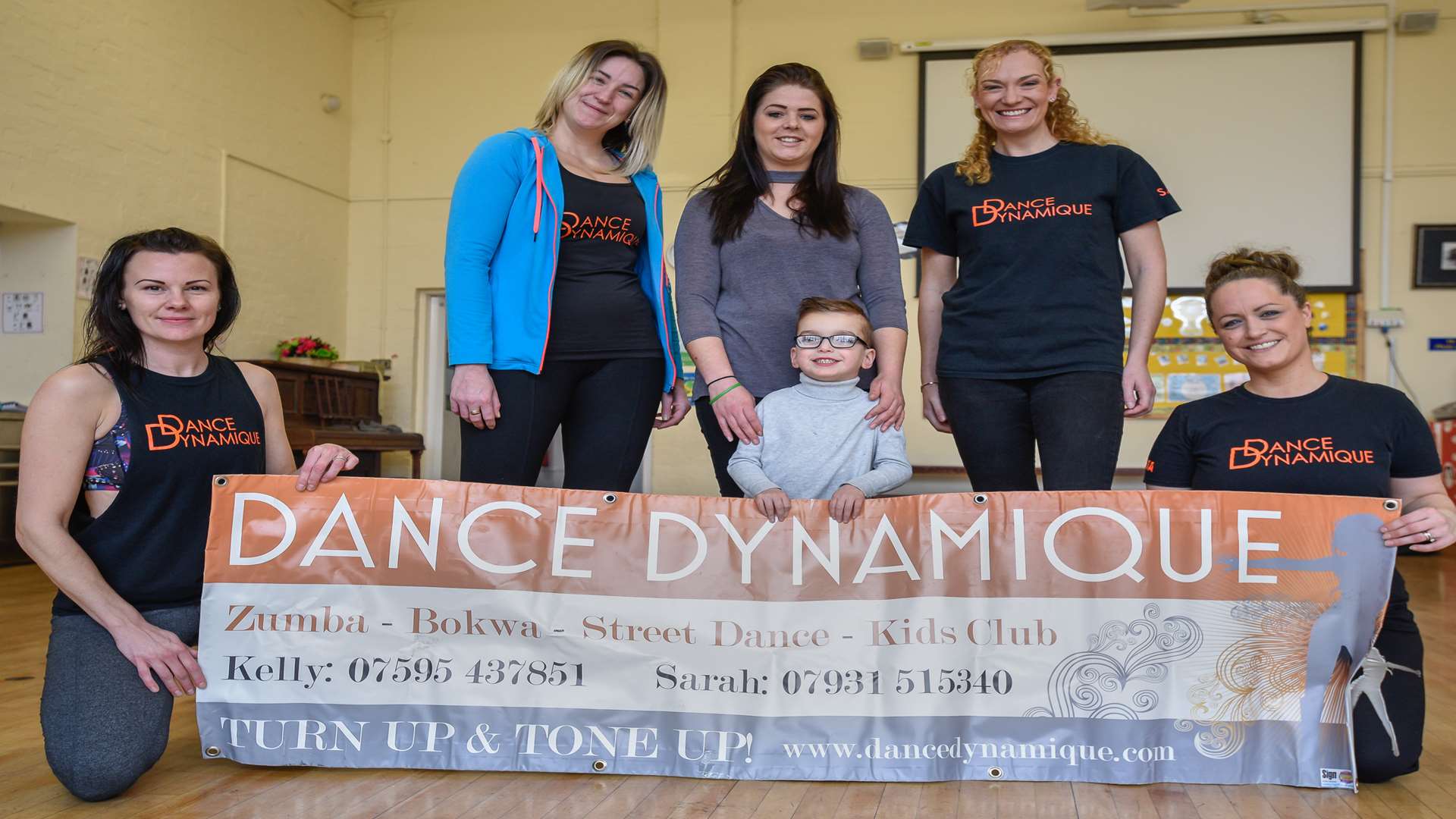 Dance Dynamique is holding a fundraising performance for Theo's Mission to Walk. Here he's pictured with Sophie Morrish, Kelly Woodward, mum Naomi Morton, Sarah Maynard and Emma Fay