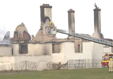 A firefighter continues to aim water onto the former Prince's clubhouse. Picture: TERRY SCOTT