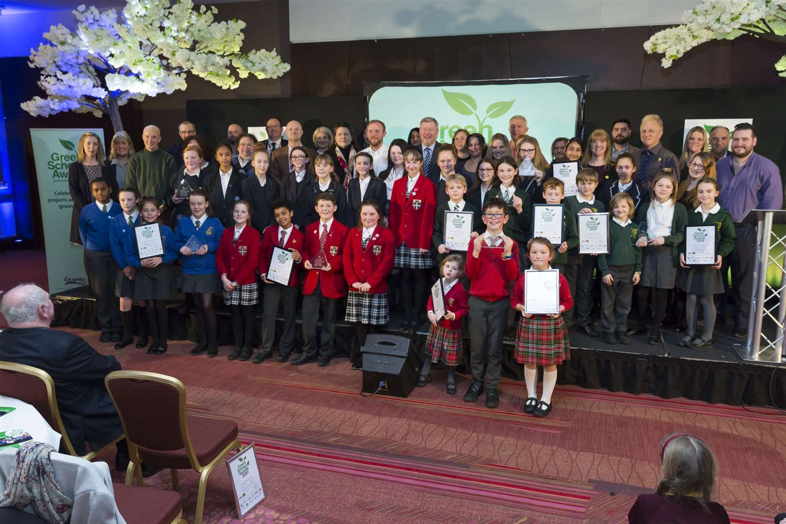 Winners and supporters celebrate at the Green School Awards at Ashford International Hotel.