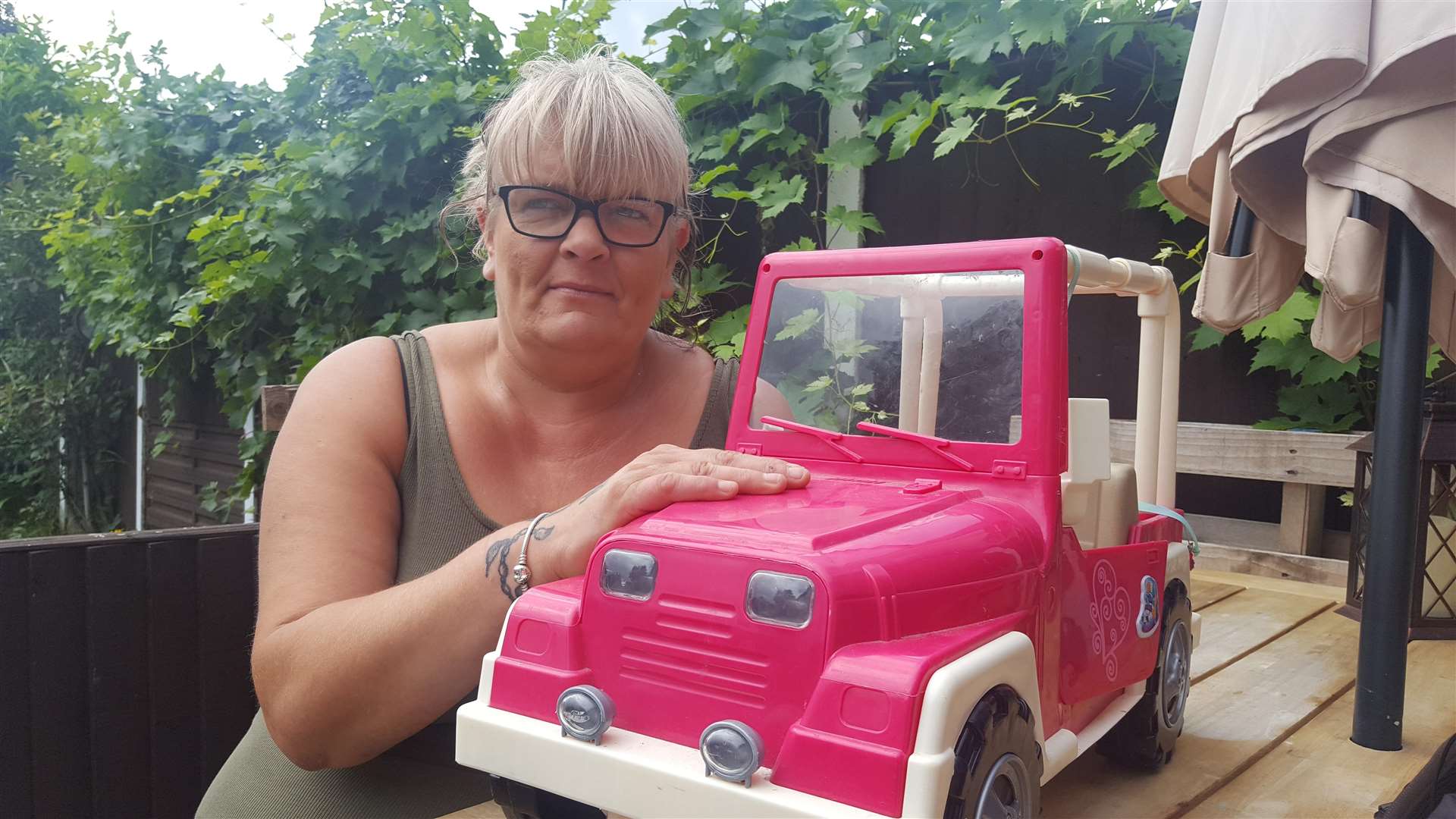 Tina Foster with the car she used to fight off the intruders