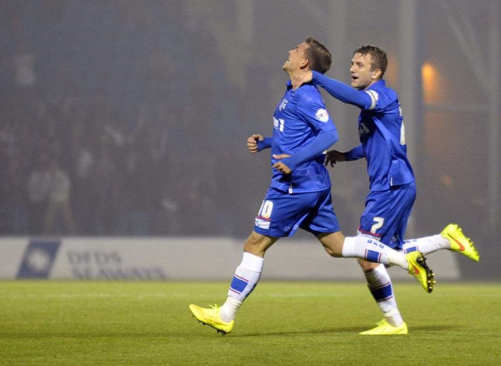 Gills striker Cody McDonald celebrates a goal in the win over Peterborough Pic: Barry Goodwin