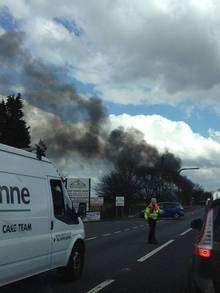 Smoke pours from a car on fire on the A249 Detling Hill