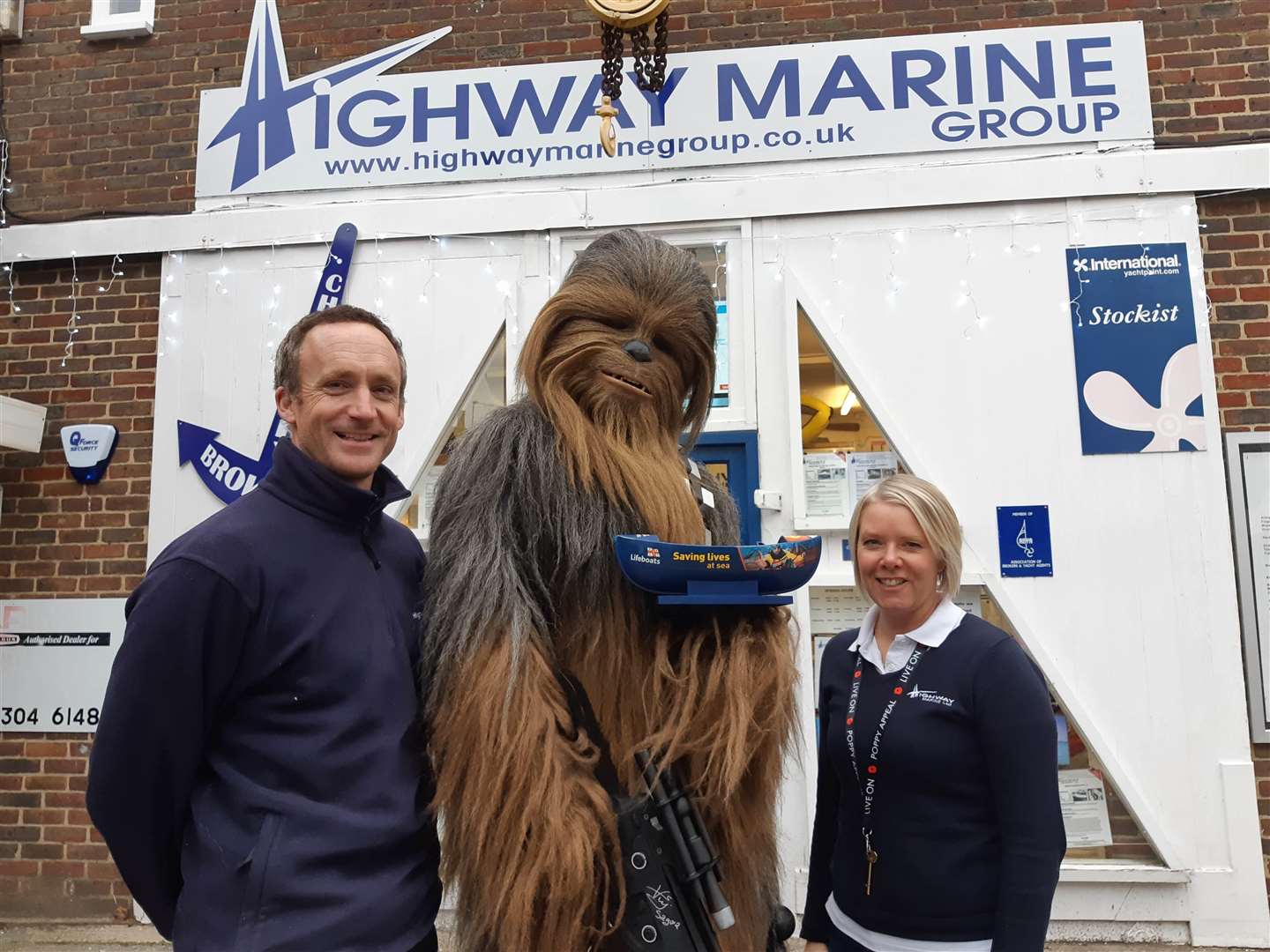 Chewbacca with Highway Marine director James Blackmore and officer manager Philippa Holt (6015612)