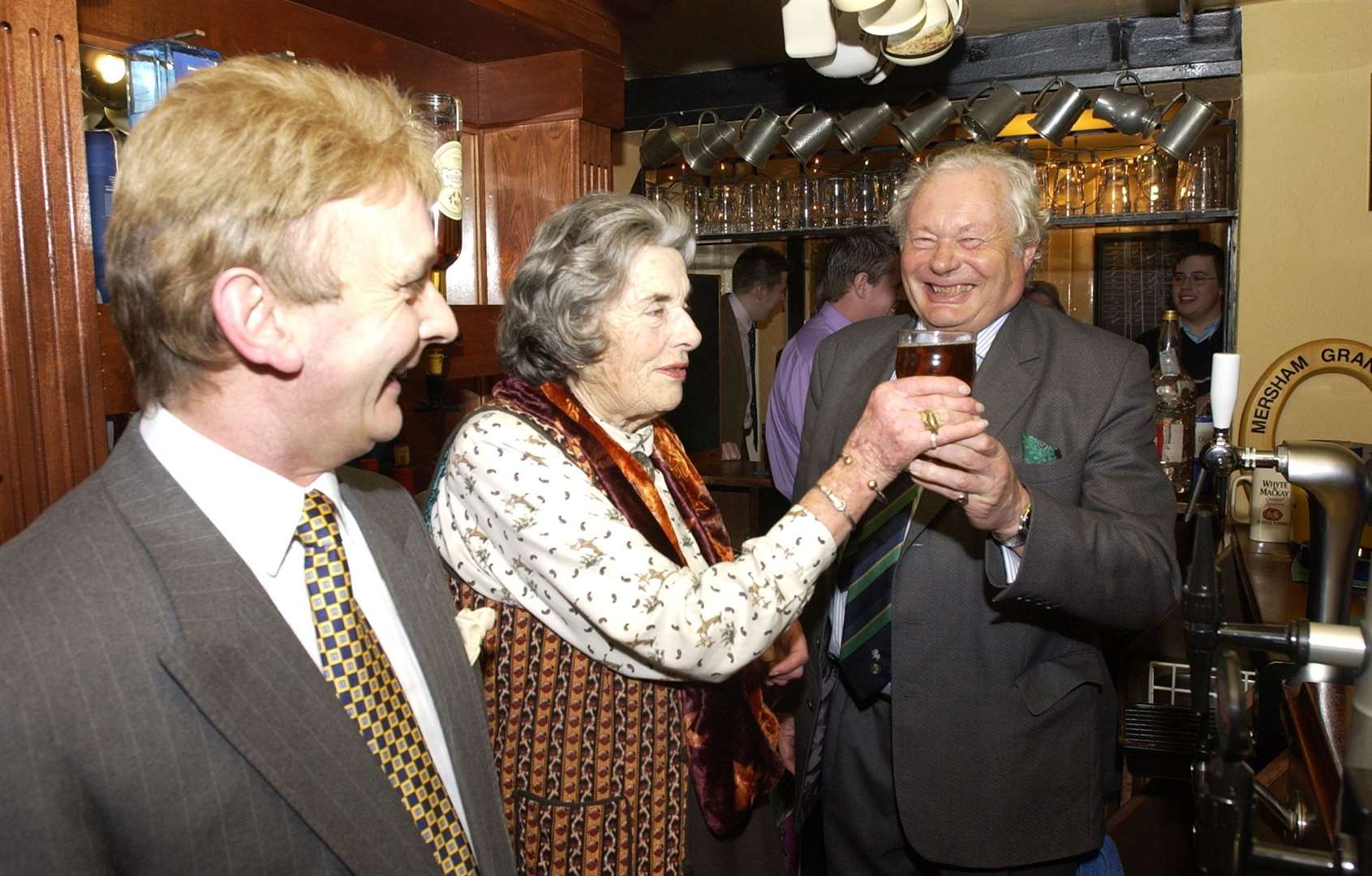 Countess Mountbatten, known locally as Lady Brabourne, pulled a pint when she reopened the Royal Oak in 2002, pictured with then-landlord Ian Cook and Robert Neame