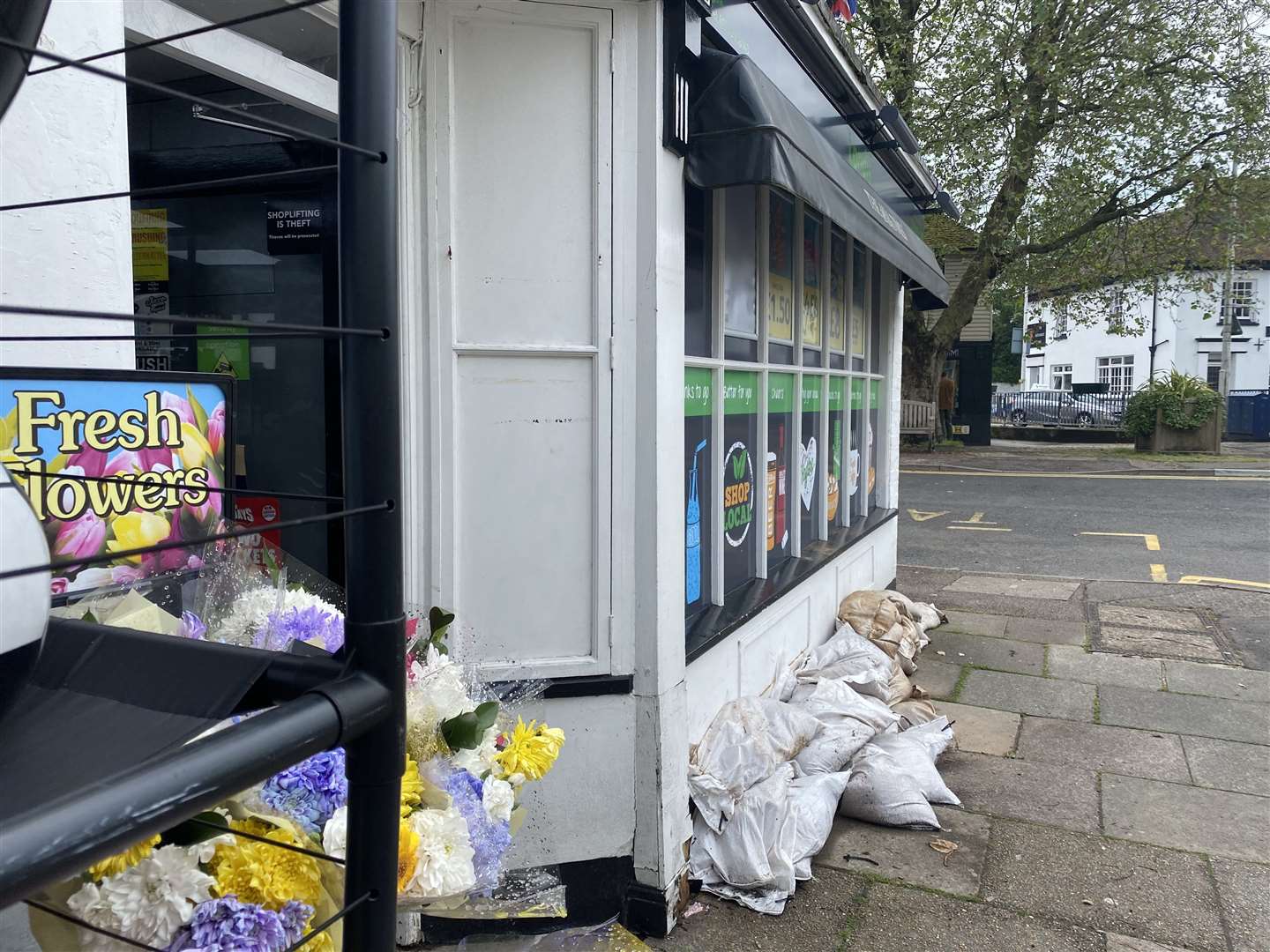 There are sandbags outside Terry and Kent newsagents in Hythe. The shop was flooded overnight
