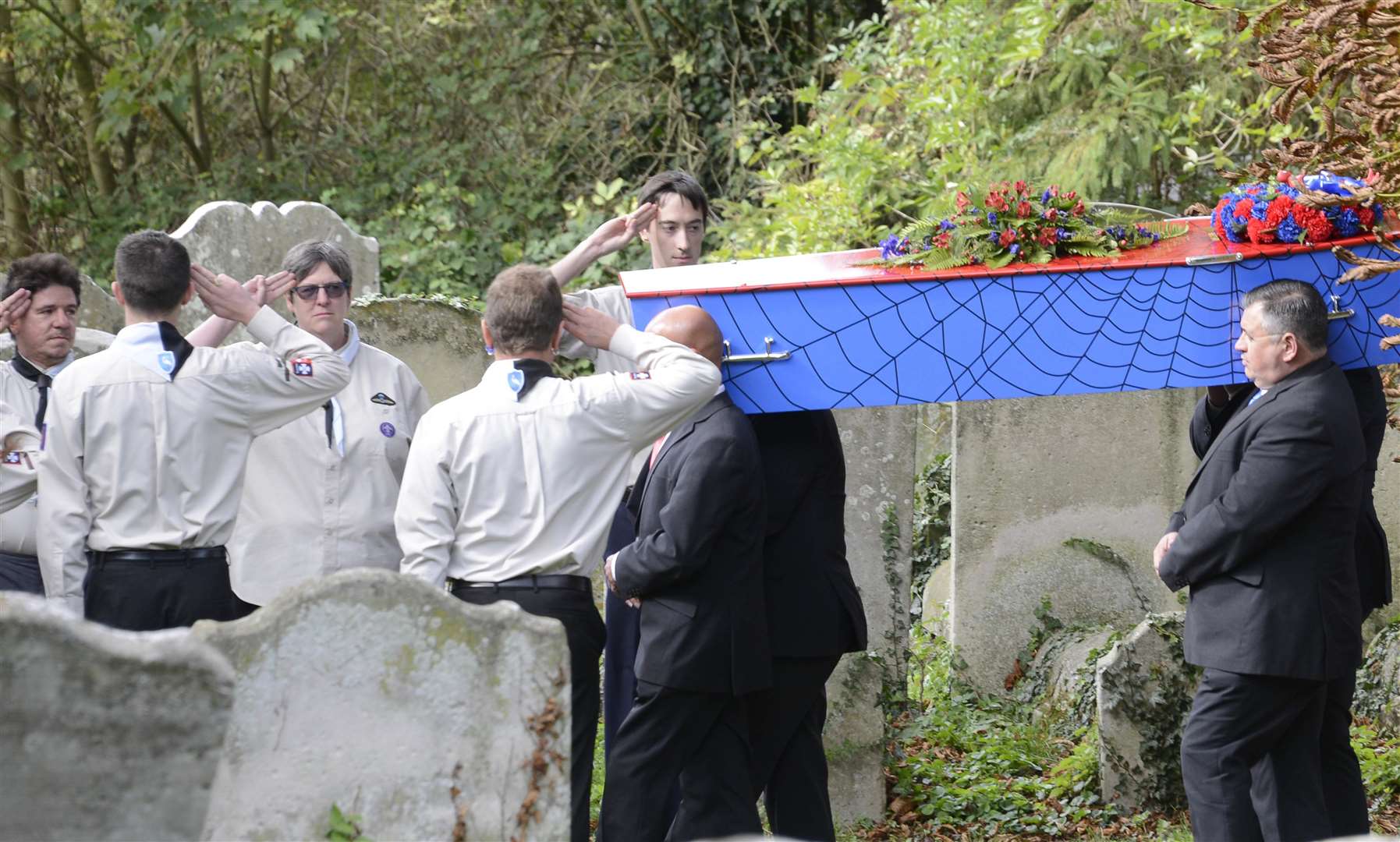 Scouts salute Sam's coffin