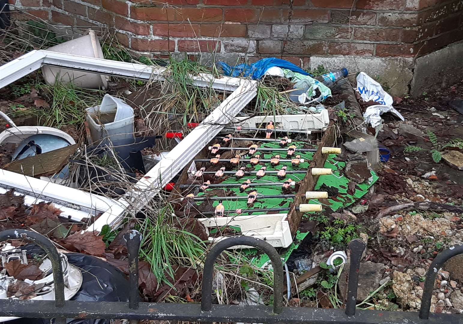 An abandoned tabletop football set in the front garden