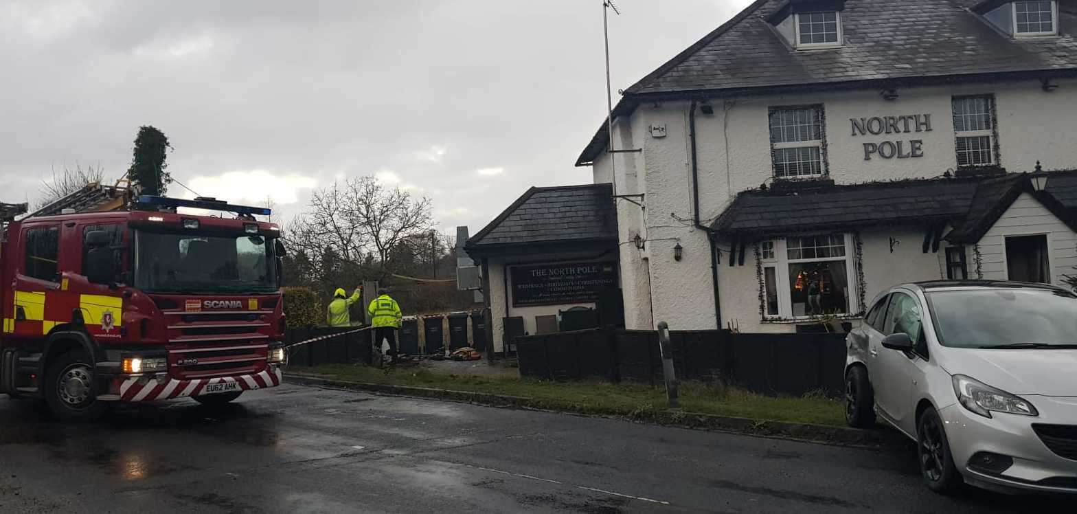 Fire crews outside the North Pole pub in Wateringbury where a two-car collision saw a silver Volvo crash through the fence and sever a gas pipe