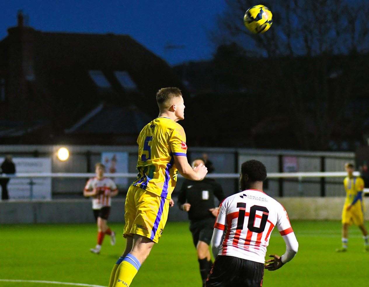 Sittingbourne defender Joe Tyrie heads clear ahead of Sheppey United striker Javaun Splatt during a Boxing Day 3-3 draw. Picture: Marc Richards