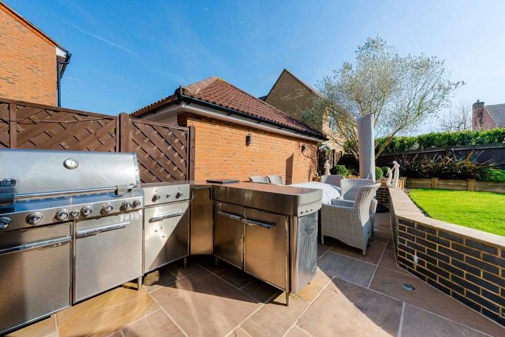 The outdoor cooking area provides ample space for even the largest of barbecues