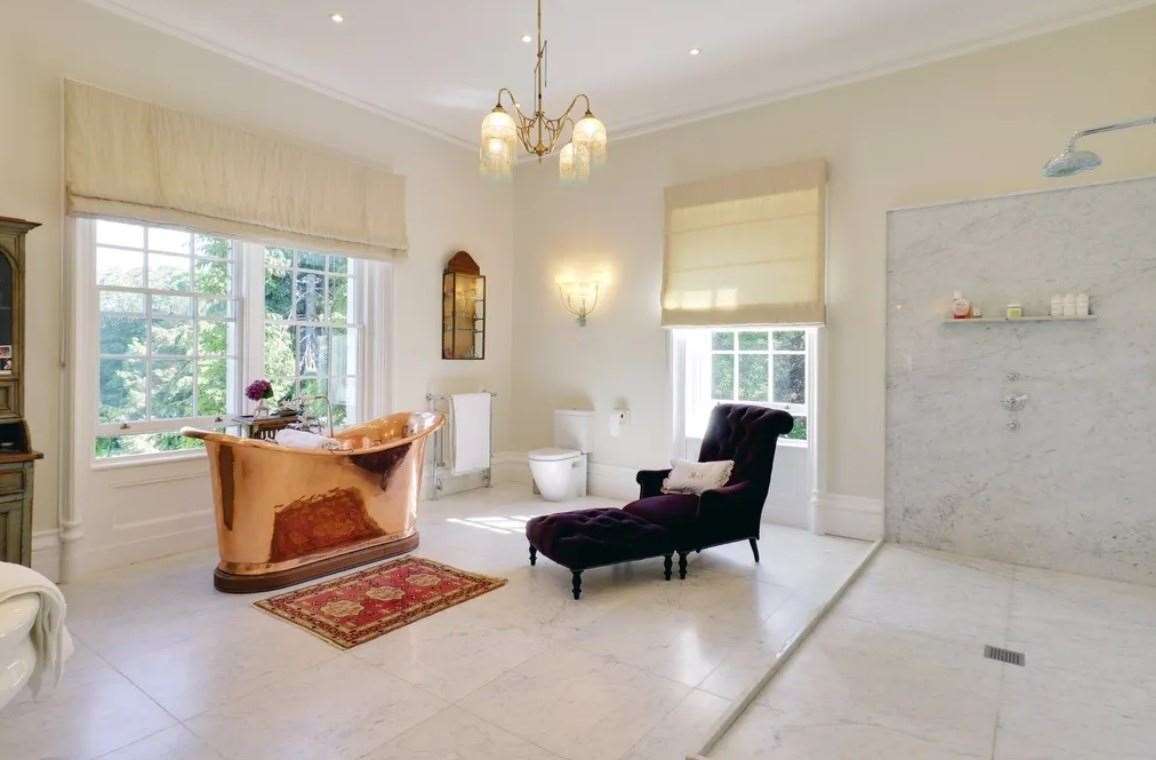 One of the five bathrooms, with walk-in shower and roll-top copper bath. Picture: Zoopla / Savills