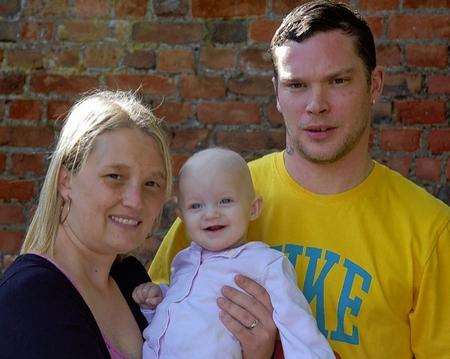 Michael and Natalie Kay with baby daughter Darcie who has been fighting cancer.