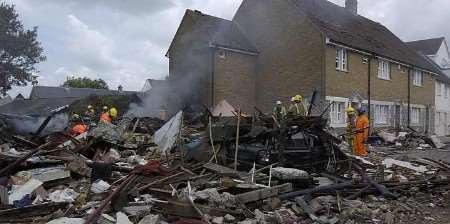 Firefighters at the scene of devastation. Picture: CHRIS DAVEY