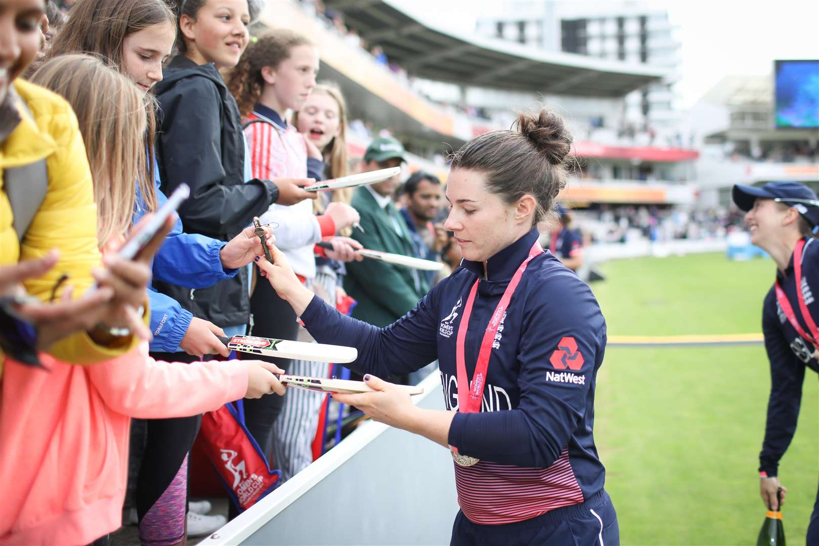 Tammy Beaumont signs autographs during the 2017 World Cup final against India. Picture: Tom Shaw Images/Getty