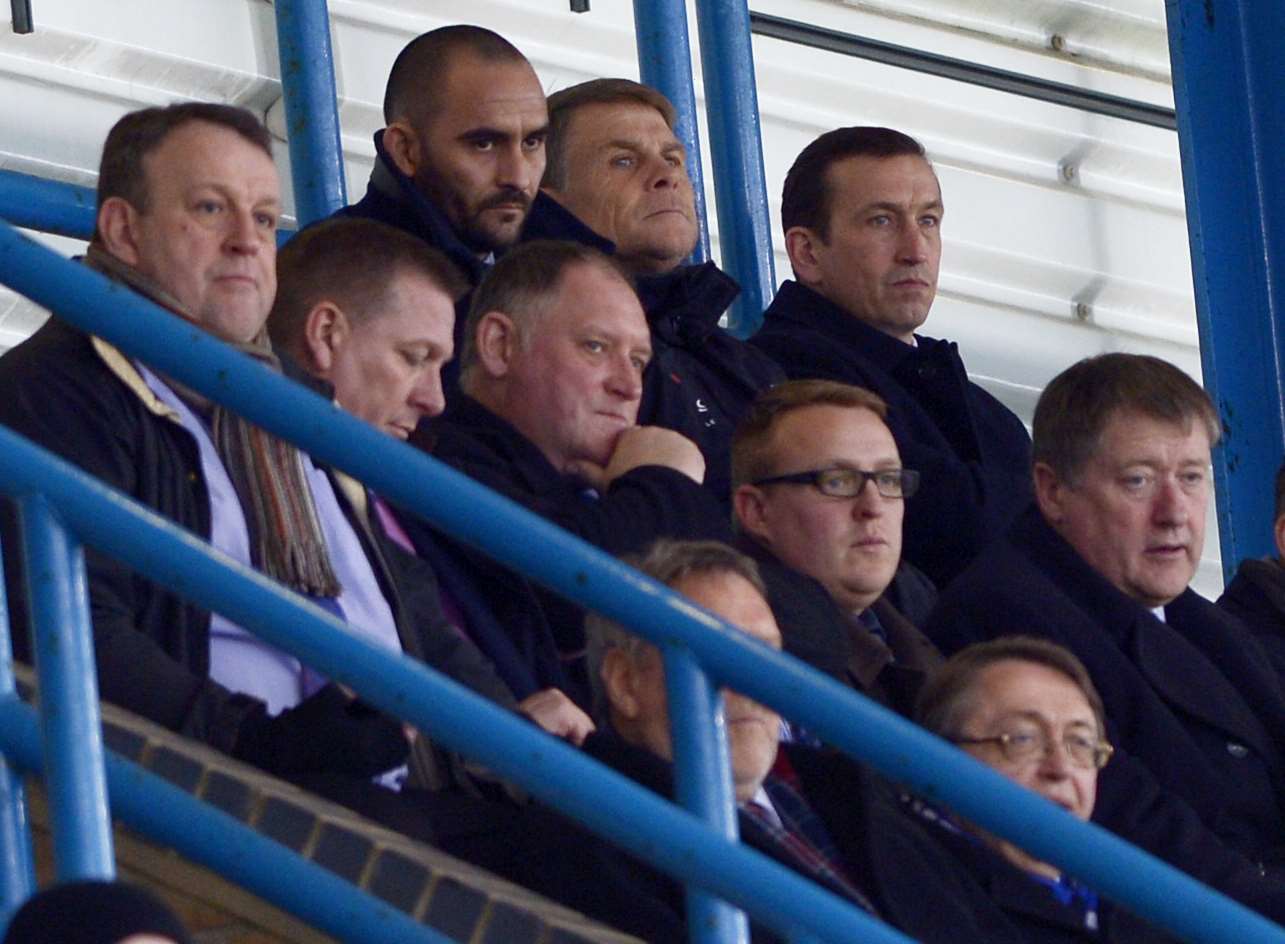 Justin Edinburgh watches from the stands alongside Andy Hessenthaler as the Gills beat Sheffield United 2-0 Picture: Barry Goodwin