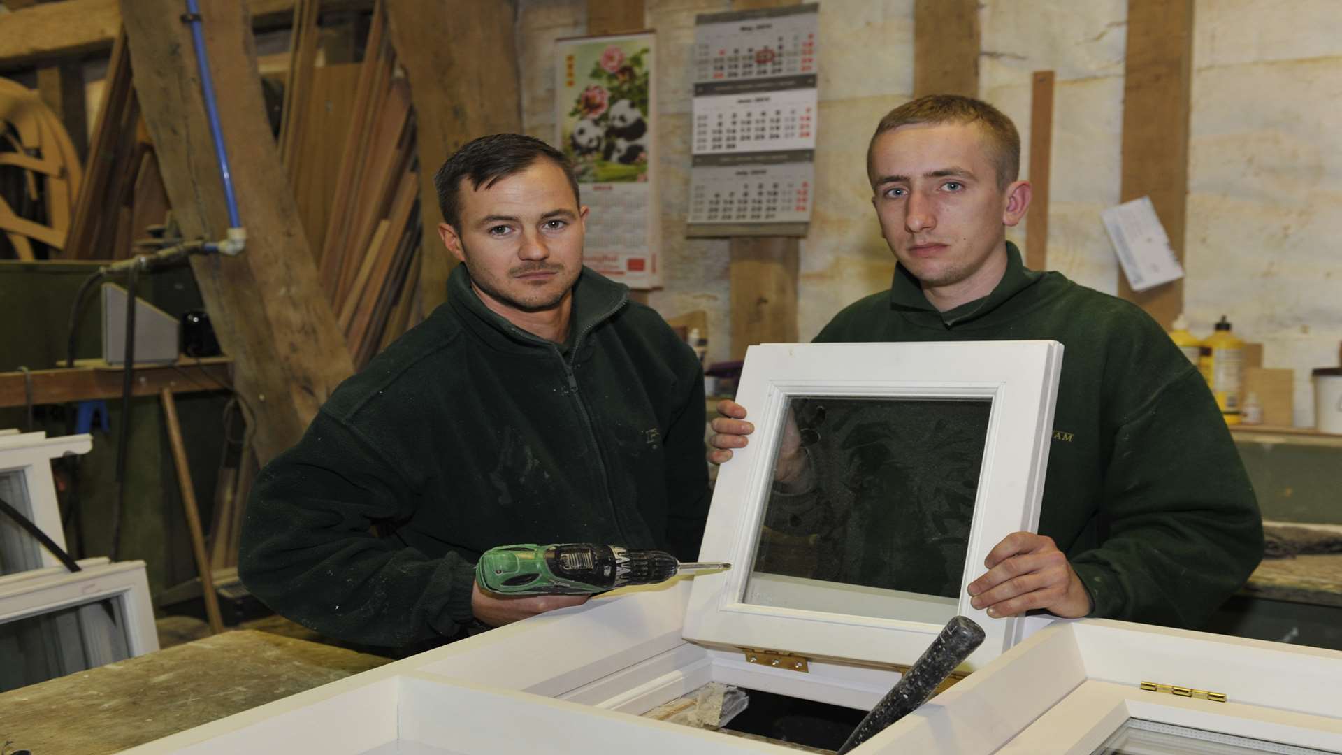 Workers Danny West and Charlie Anning making do with their remaining tools after £15,000 worth of tools were stolen.