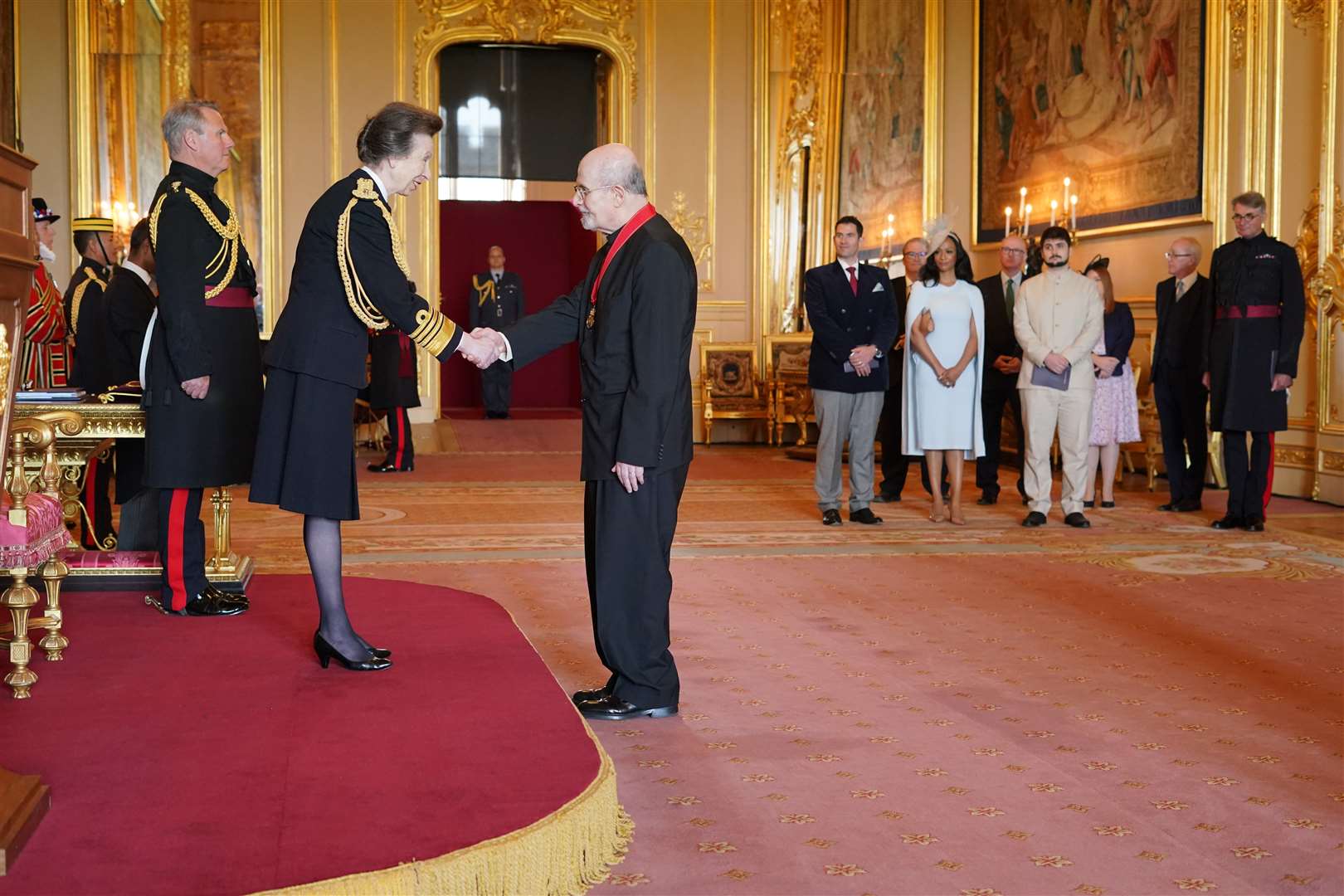 Sir Salman Rushdie is made a Companion of Honour by the Princess Royal at Windsor Castle (PA)