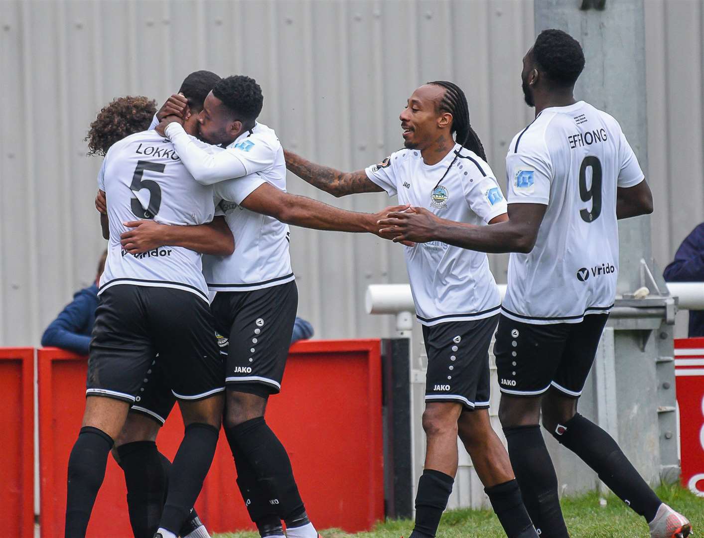 Kevin Lokko (No.5) is mobbed after scoring for Dover against Notts County Picture: Alan Langley