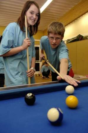 Elisha Bergin and Nick Ralph shoot some pool during the opening of the Parklife centre