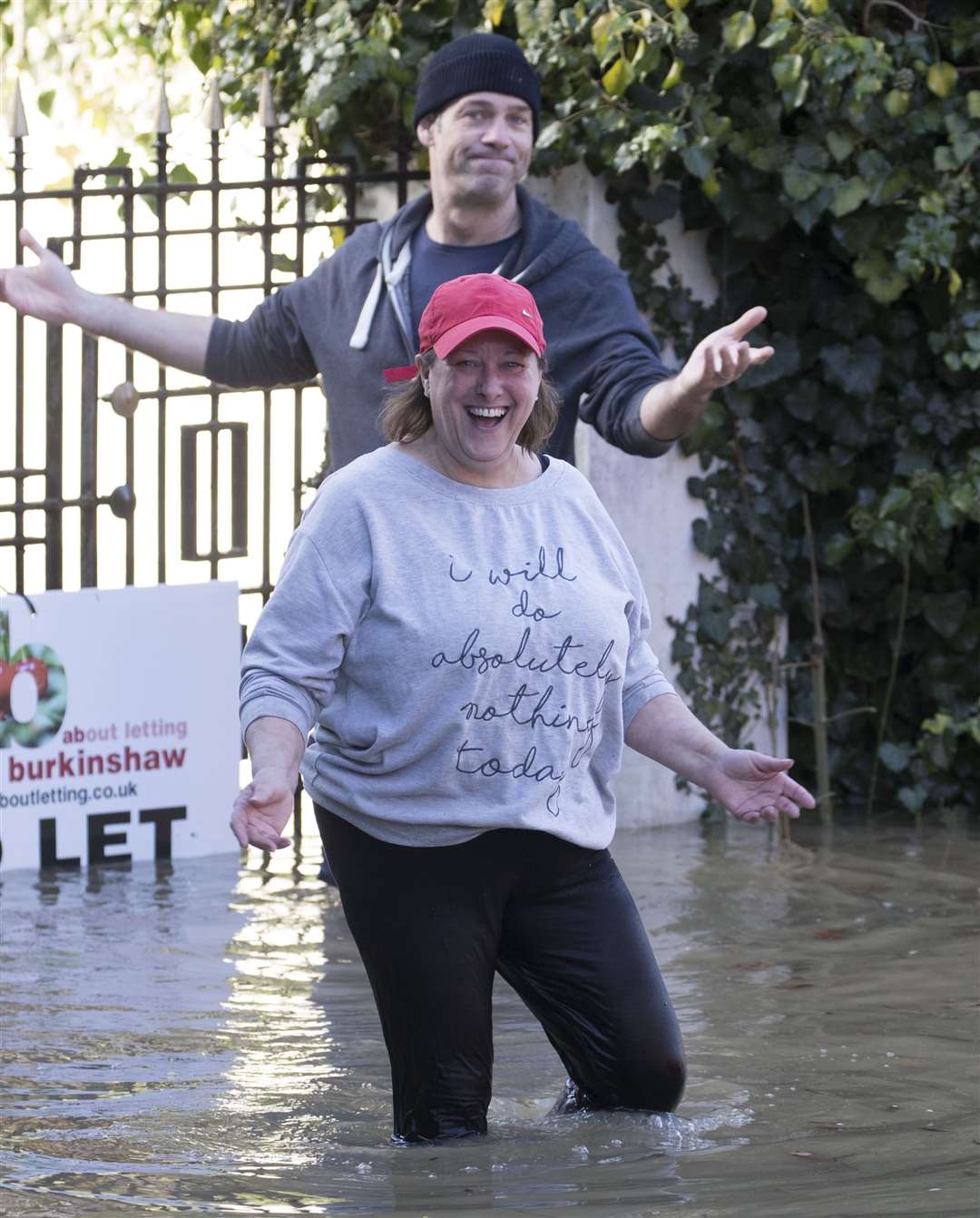 Residents put on a brave face outside a flooded home in Yalding. Pic: Stephen Lock/i-Images