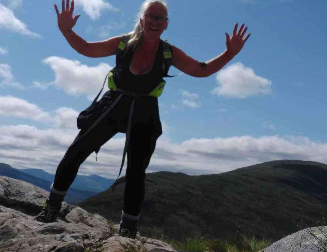 Natalie on a mountain after climbing The Devil's Staircase in Scotland