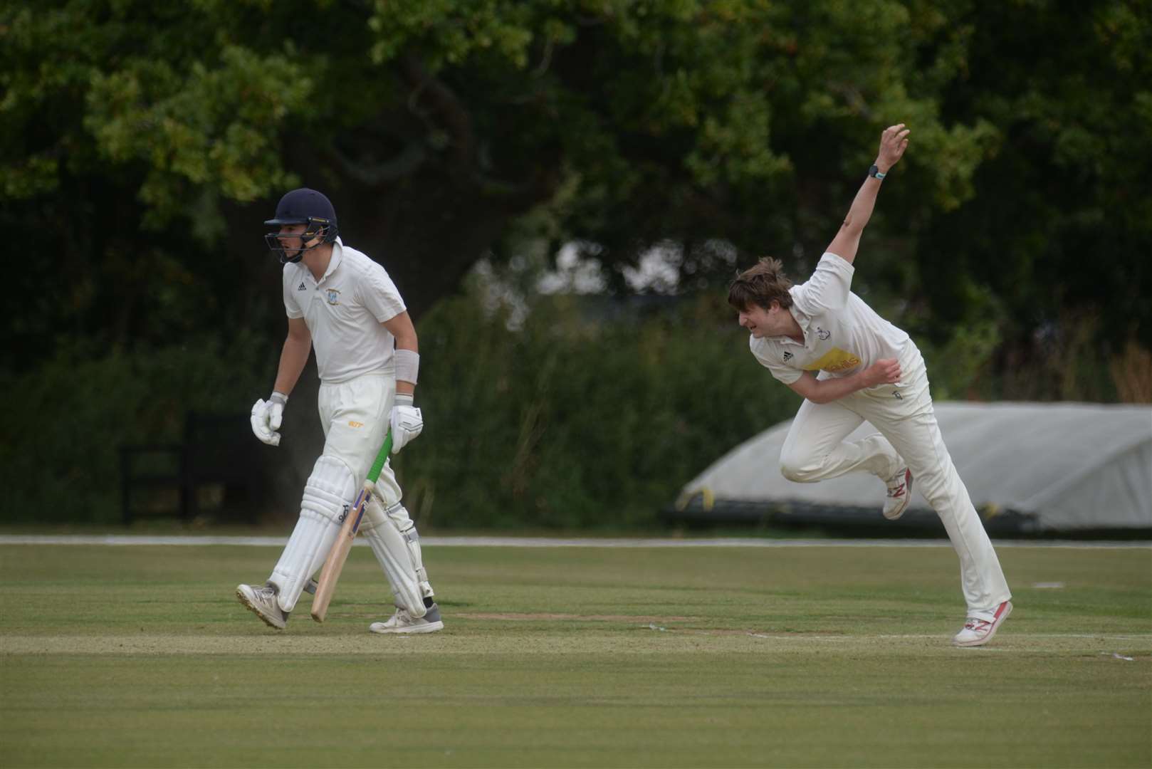 Canterbury's Ben Rutherford watches the action as Sevenoaks bowler Tom Parsons sends down another delivery. Picture: Chris Davey