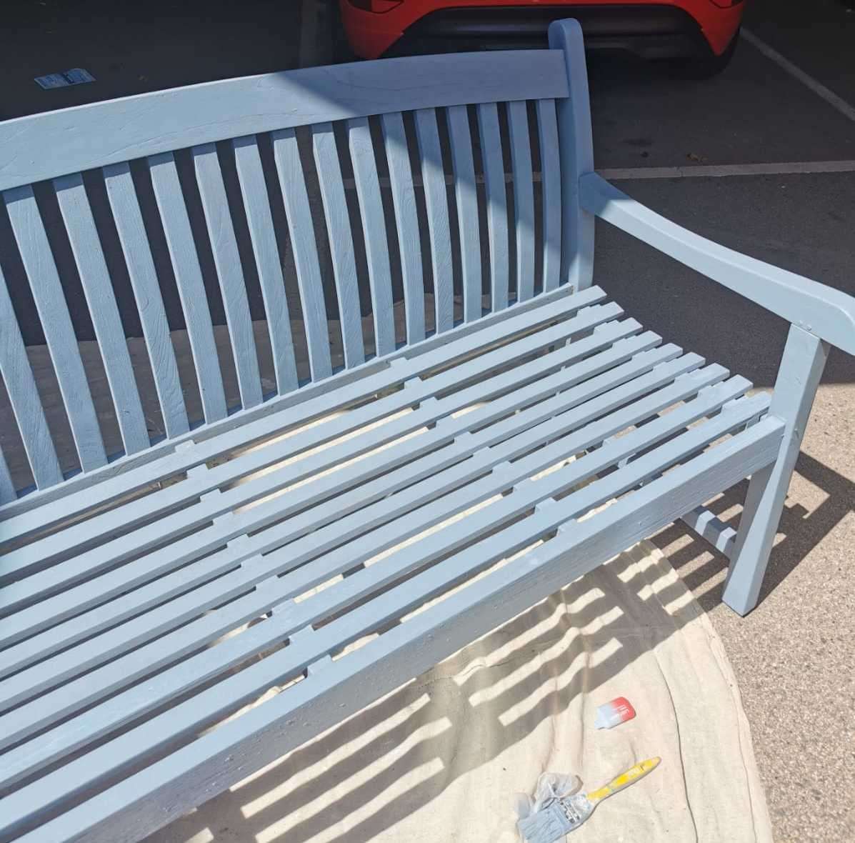 Ms Canning repaired the benches and gave them a fresh coat of blue paint. Photo: Kayley Canning
