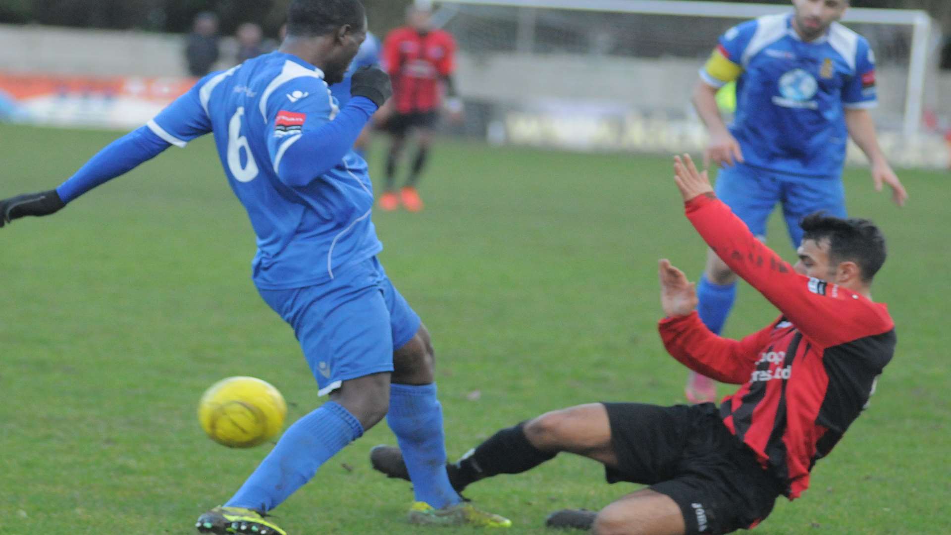Chatham, in red, take a tumble during their 5-0 defeat by Aveley Picture: Steve Crispe