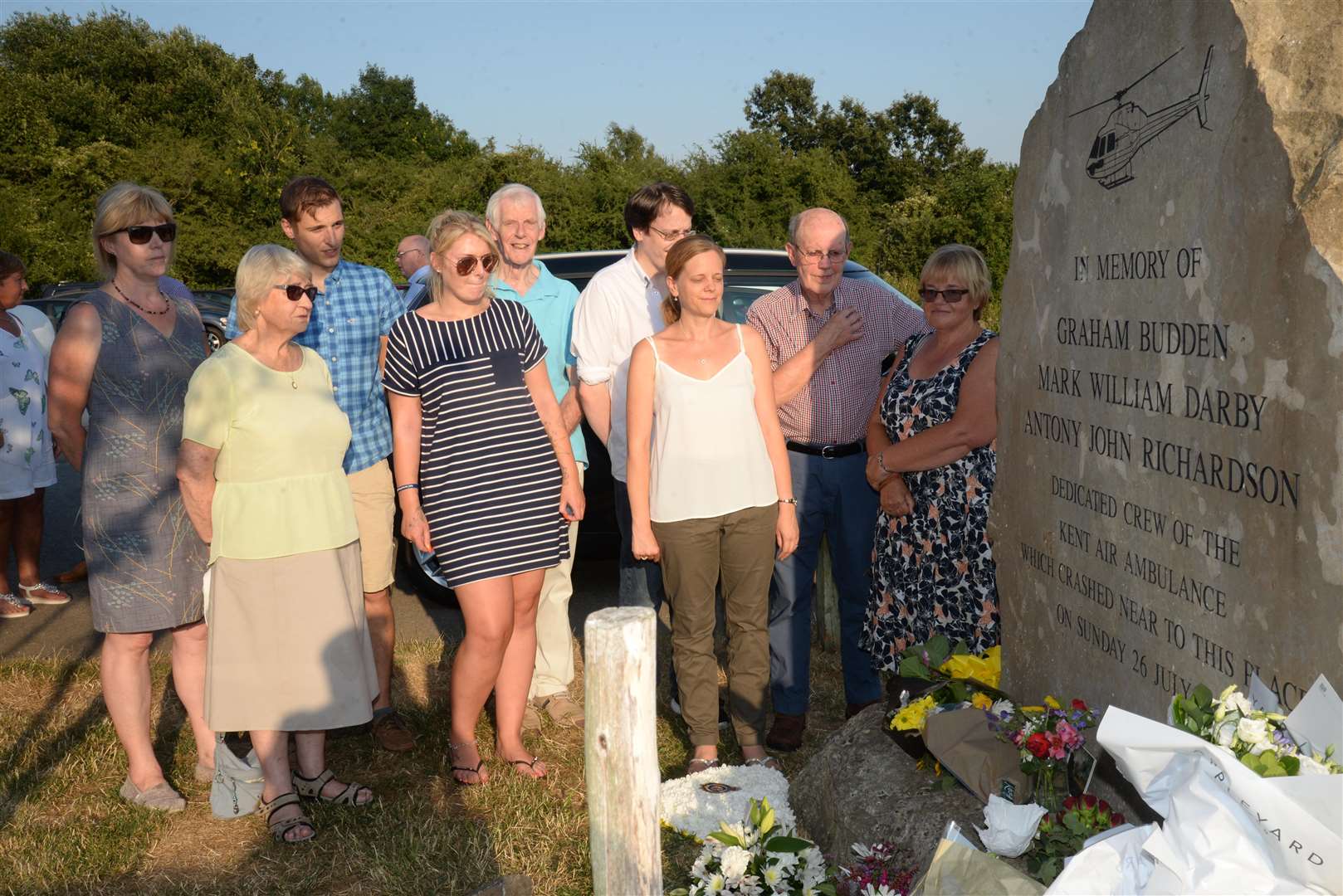 The families of the air ambulance crew who died in a crash 20-years ago at their memorial at Bluebell Hill on Thursday . Picture: Chris Davey. (3303990)