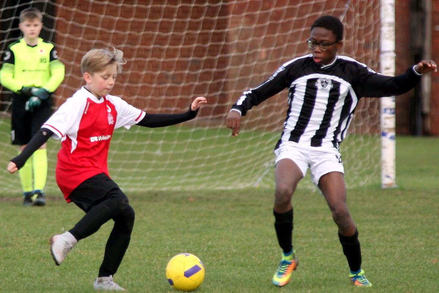 Milton & Fulston United under-13s (stripes) compete against Omega 92 under-13s. Picture: Phil Lee FM21312811