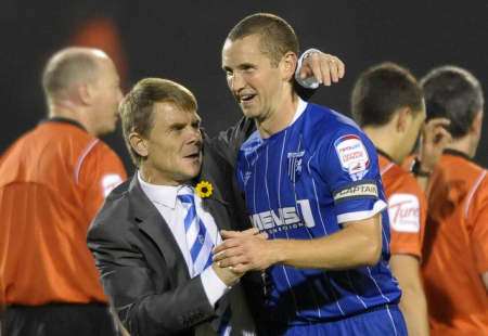 Gillingham manager Andy Hessenthaler and captain Andy Frampton celebrate at ther final whistle