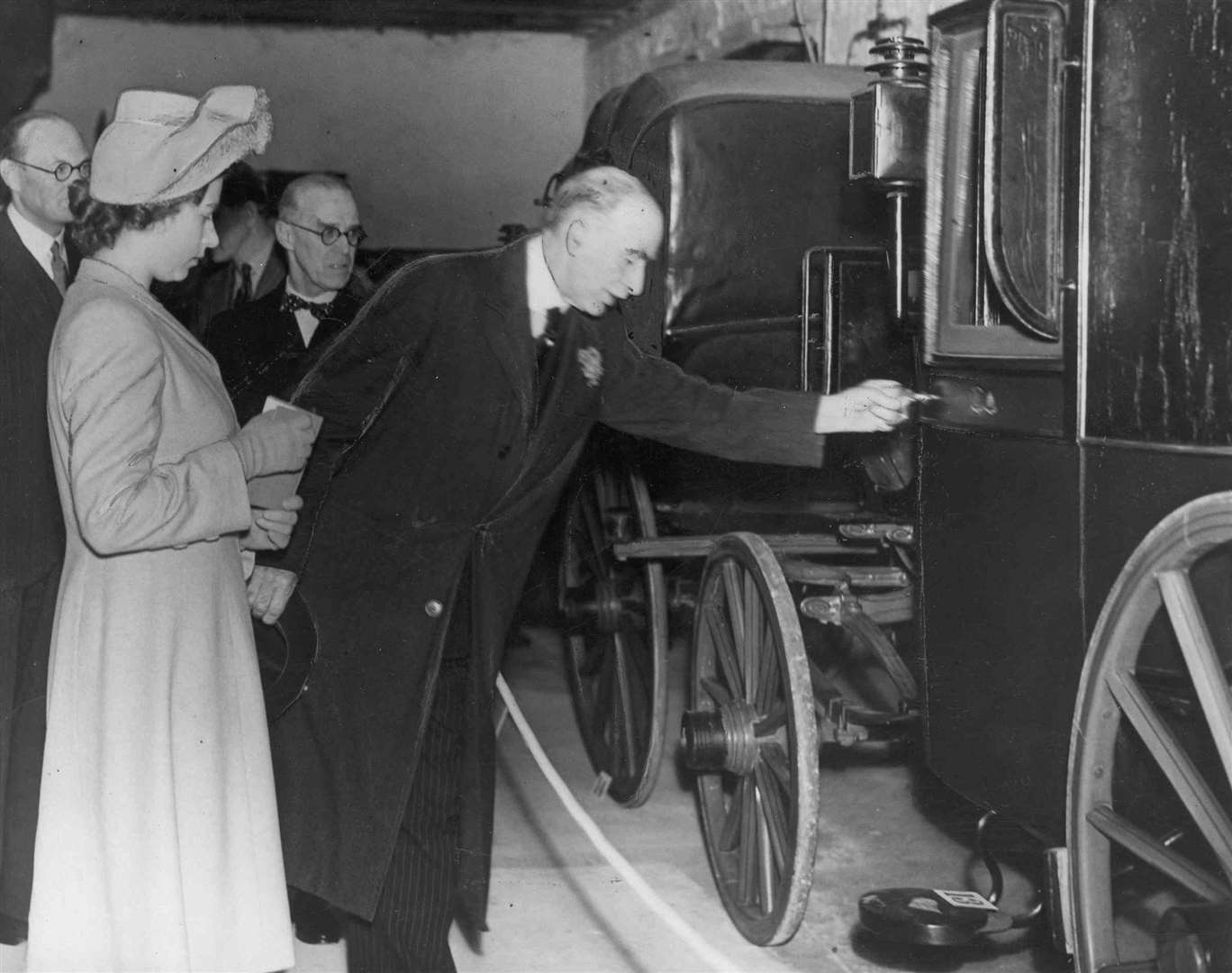 Princess Elizabeth made a private visit to Maidstone Carriage Museum as the guest of Sir Garrard and Lady Tyrrwhitt-Drake and saw a travelling chariot used by King George III. Picture: Images of Royal Kent
