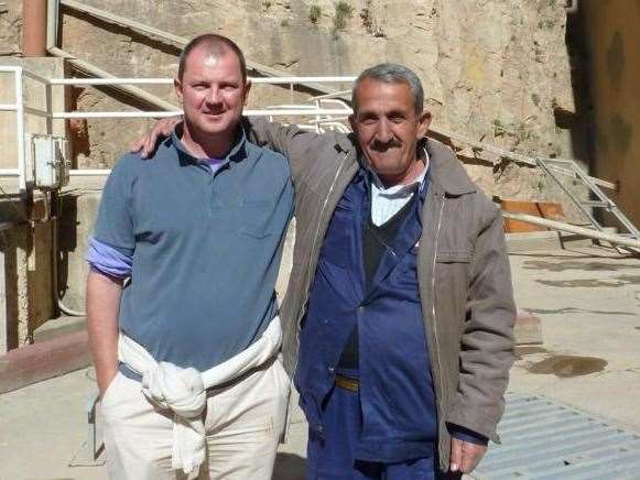 Barry Manners with a worker at Dukan Dam, where he was held during his time in captivity, during a visit to Iraq in 2011