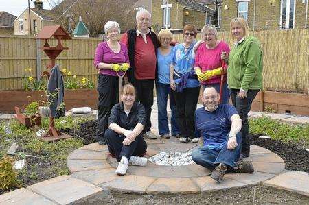 From left, rear, Maxine Hammond, Dave Hake, Pauline Hake, Linda Jones, Dawn Cockburn and Julia McDougall, with front, Tina and Russell Cashman in the community garden at Harmony Therapy Trust