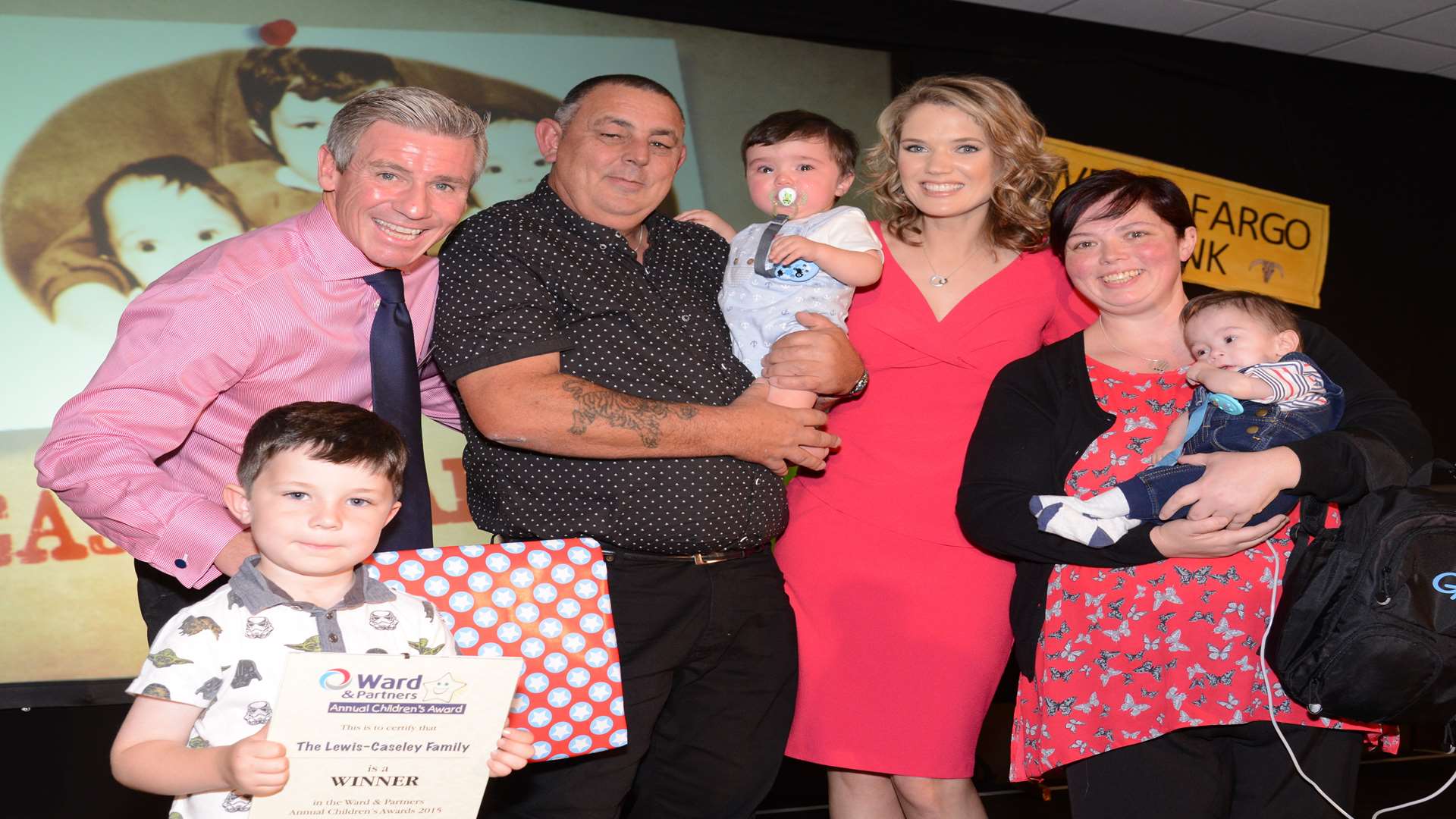 Charlotte Hawkins and Keith Lovell presenting award to the Lewis Caseley family