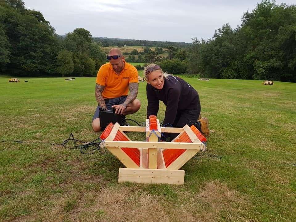 Members of the Ghengis Fireworks crew, David and Louis set up a fireworks display