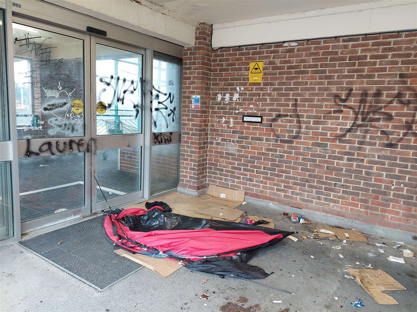 Vandals have graffitied the walls and it appears someone was sleeping in a tent at the town centre car park