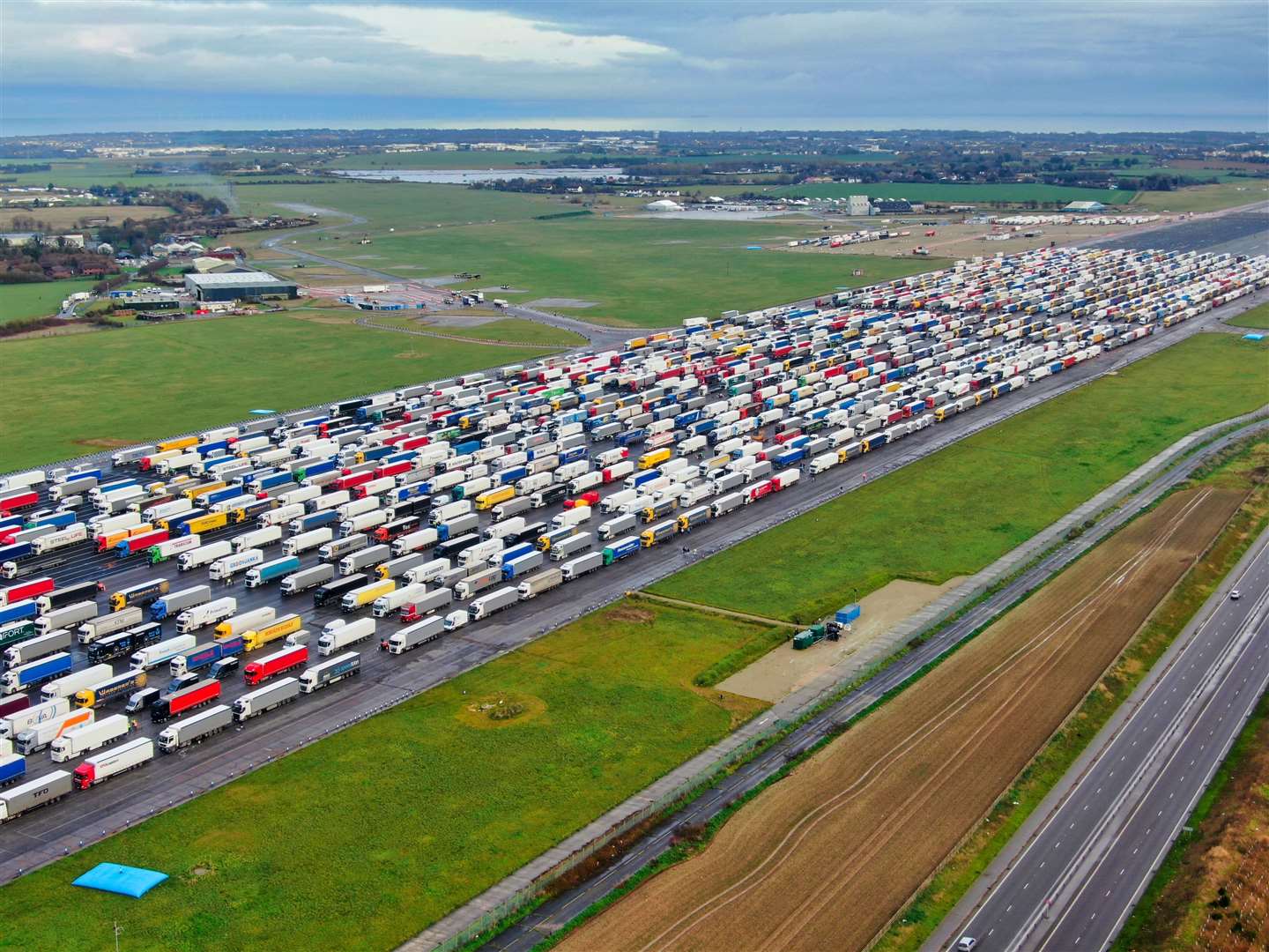 The huge number of lorries parked up at the former Manston Airport site in December 2020. Pic: Swifte Aerial Photography